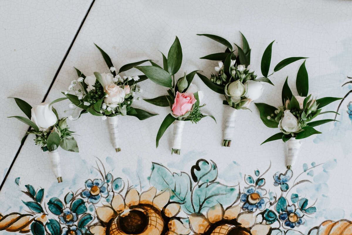 Wedding boutonnieres and rings at Villa Oliviero in Positano, Amalfi Coast, Italy