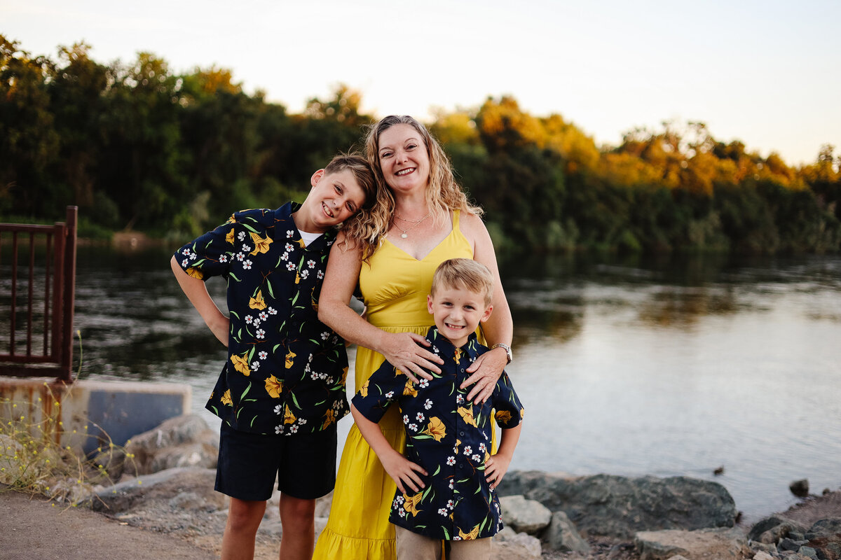 mom and sons by the river