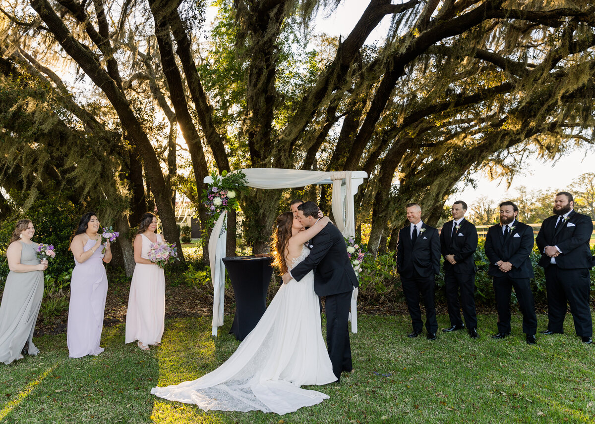 Bride and Groom First Kiss at wedding Orlando Florida captured by Orlando Wedding Photographer Blak Marie Photography