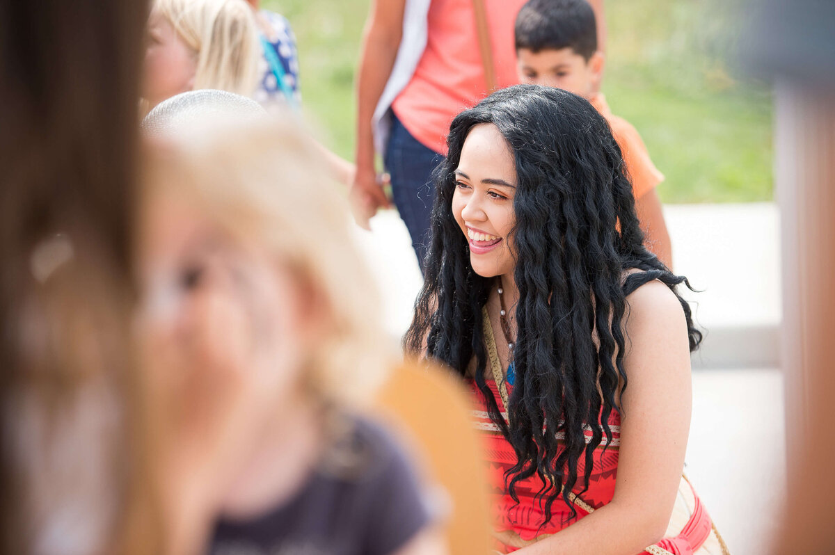 a child actor in a Moanna costume interacting with children during a corporate children's event.  Captured by Ottawa Event Photographer JEMMAN Photography COMMERCIAL