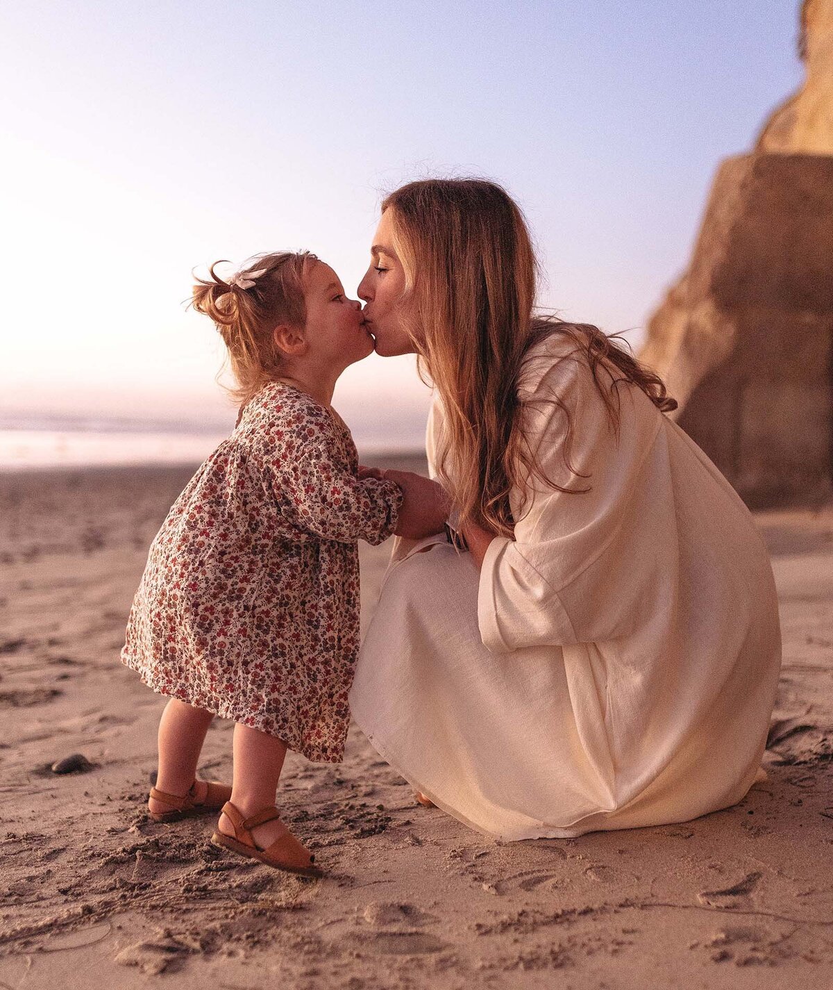 Momma kissing her baby