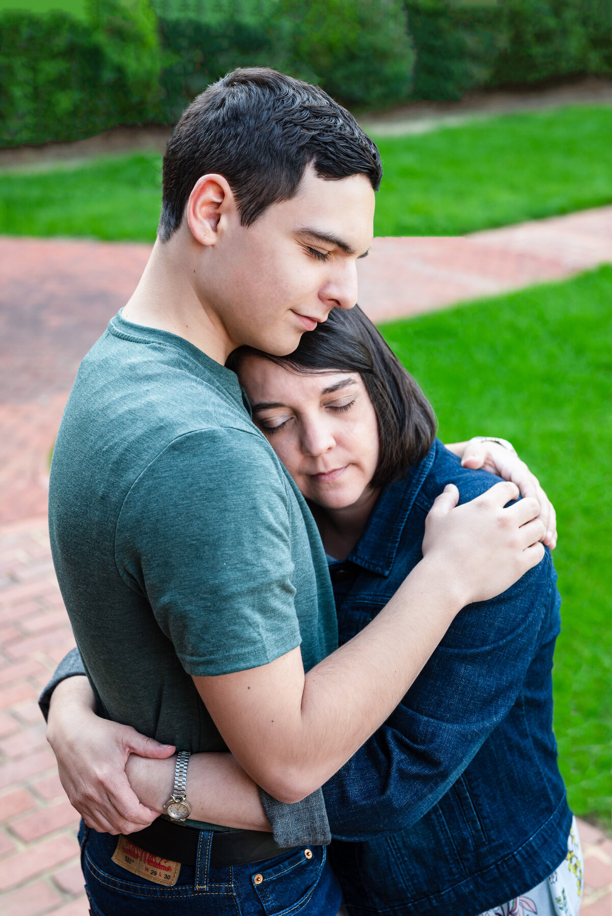 Mother and son hug during family photos in downtown Huntsville in Alabama