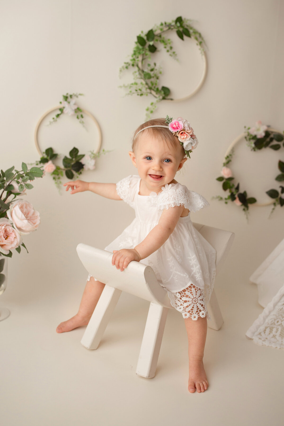 1 year old girl posing for her birthday portraits