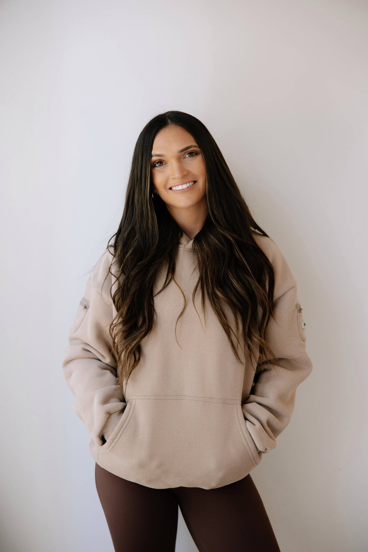 A photo of a functional health coach in a hoody during her personal brand session in Fort Collins, Colorado.