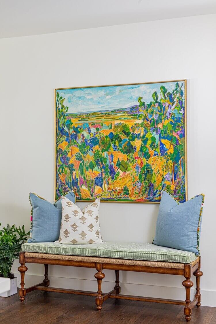 oyster creek studios highland park home colorful floral painting over stool with green blue and white pillows