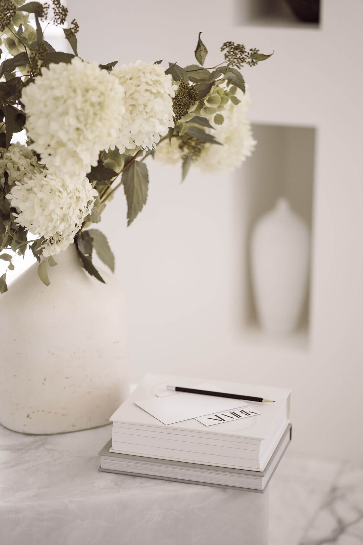 Bloomier florals beside bookstack