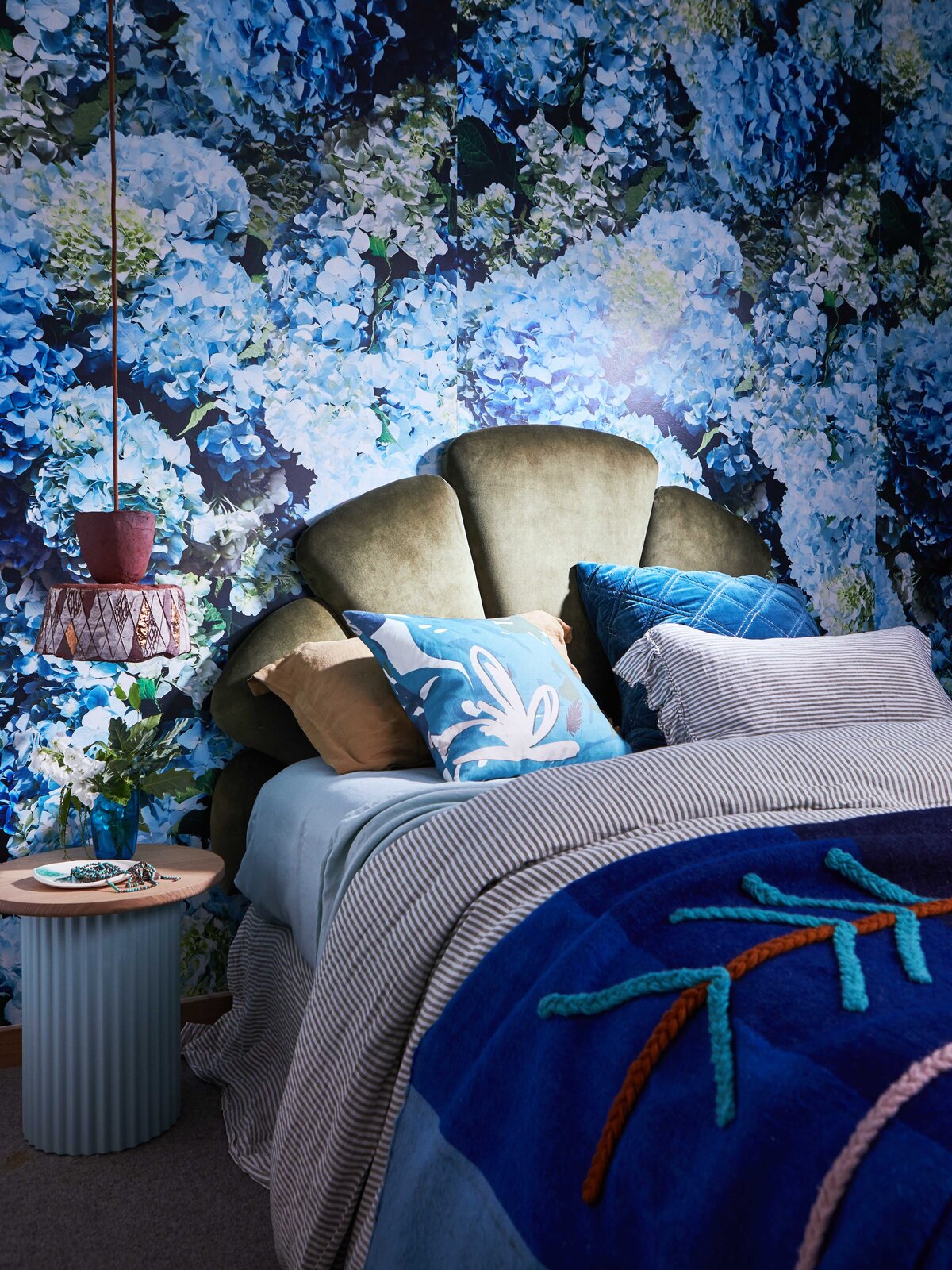 Bold blue floral wallpaper and green velvet bedhead in a Melbourne bedroom – residential interior design by Lisa Hunter Interiors
