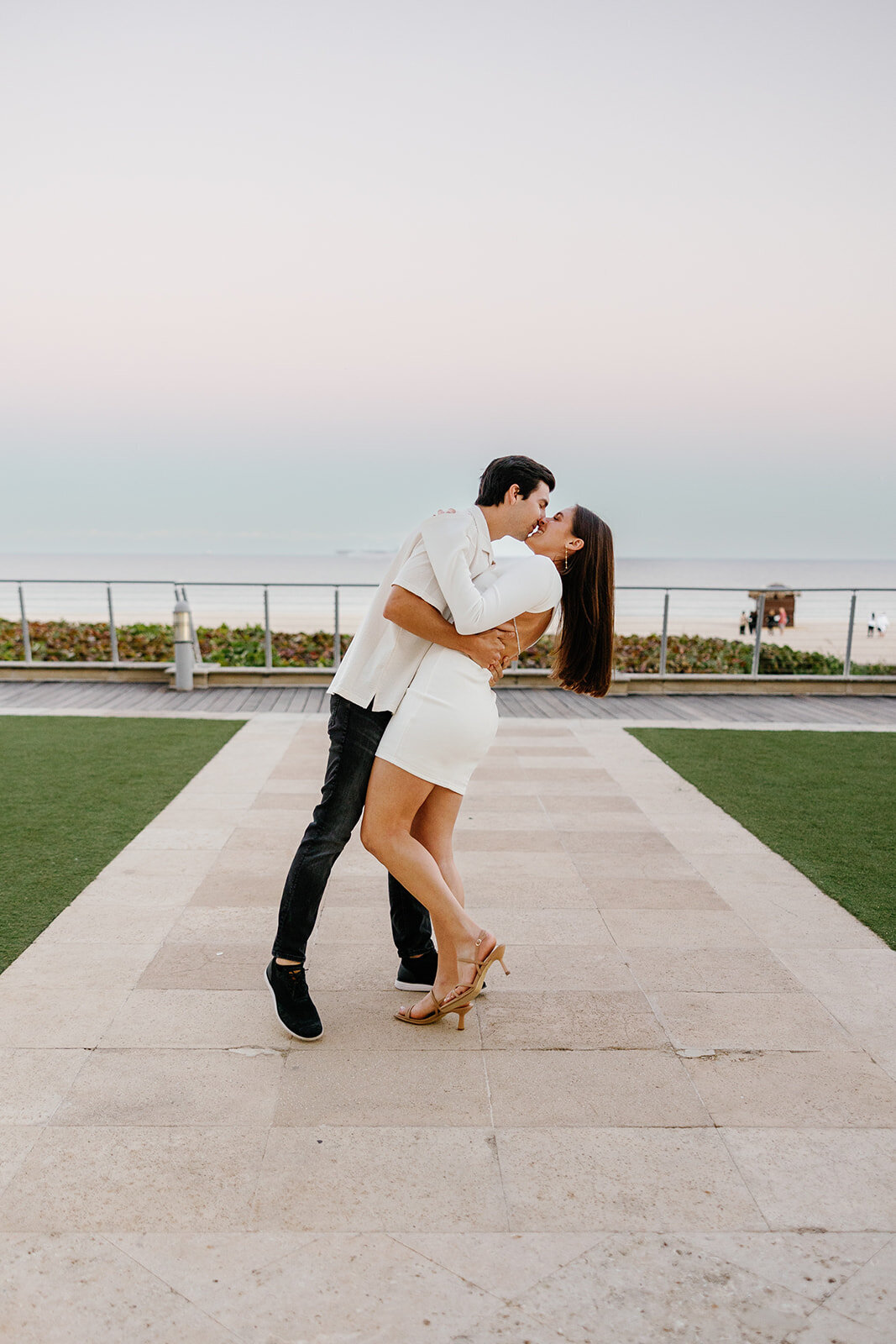 An elegant engagement portrait of Rebecca and Graysen, framed by golden-hour light, capturing their love in a sophisticated and timeless moment at Marriott Hotel Fort Lauderdale.