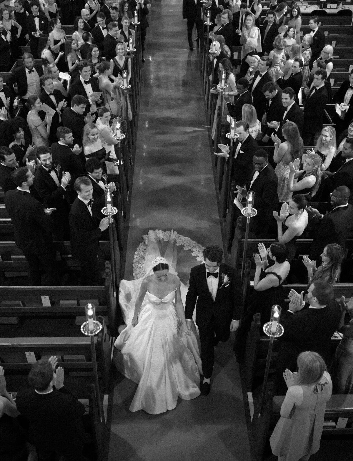 A bride and groom are photographed from above, heading down the aisle at Christ church historic wedding venue in Detroit
