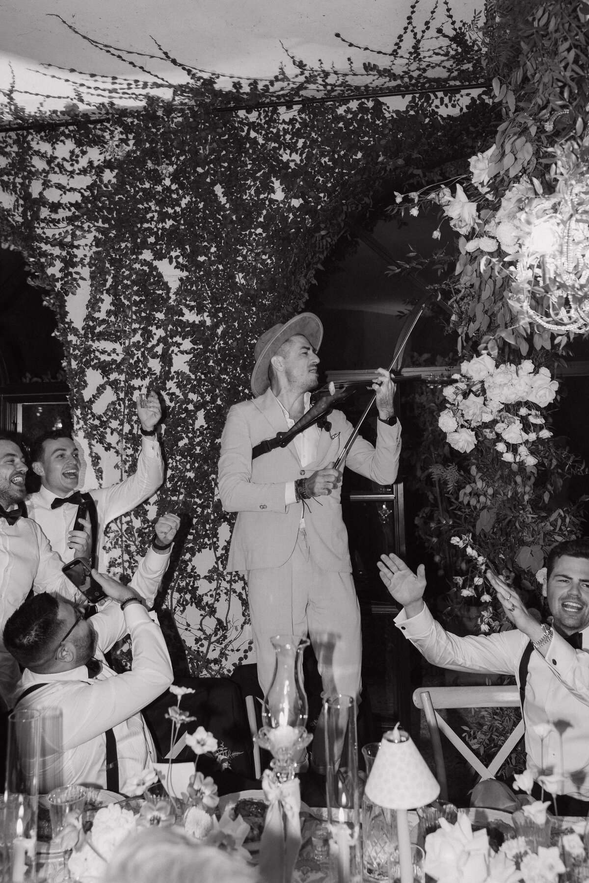 Wedding photographer captures couple taking a stroll hand in hand at their french chateau wedding.