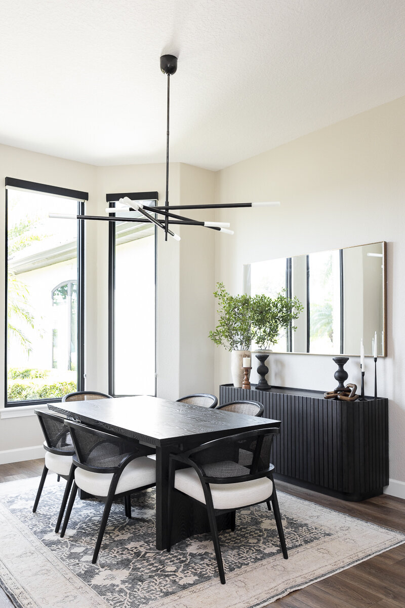 dewine design orlando interior designer windermere full home renovation dining room with black table and accent light fixture