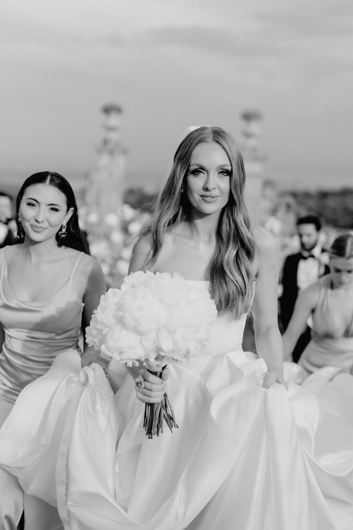 Bride walking with bridesmaids in Tuscany