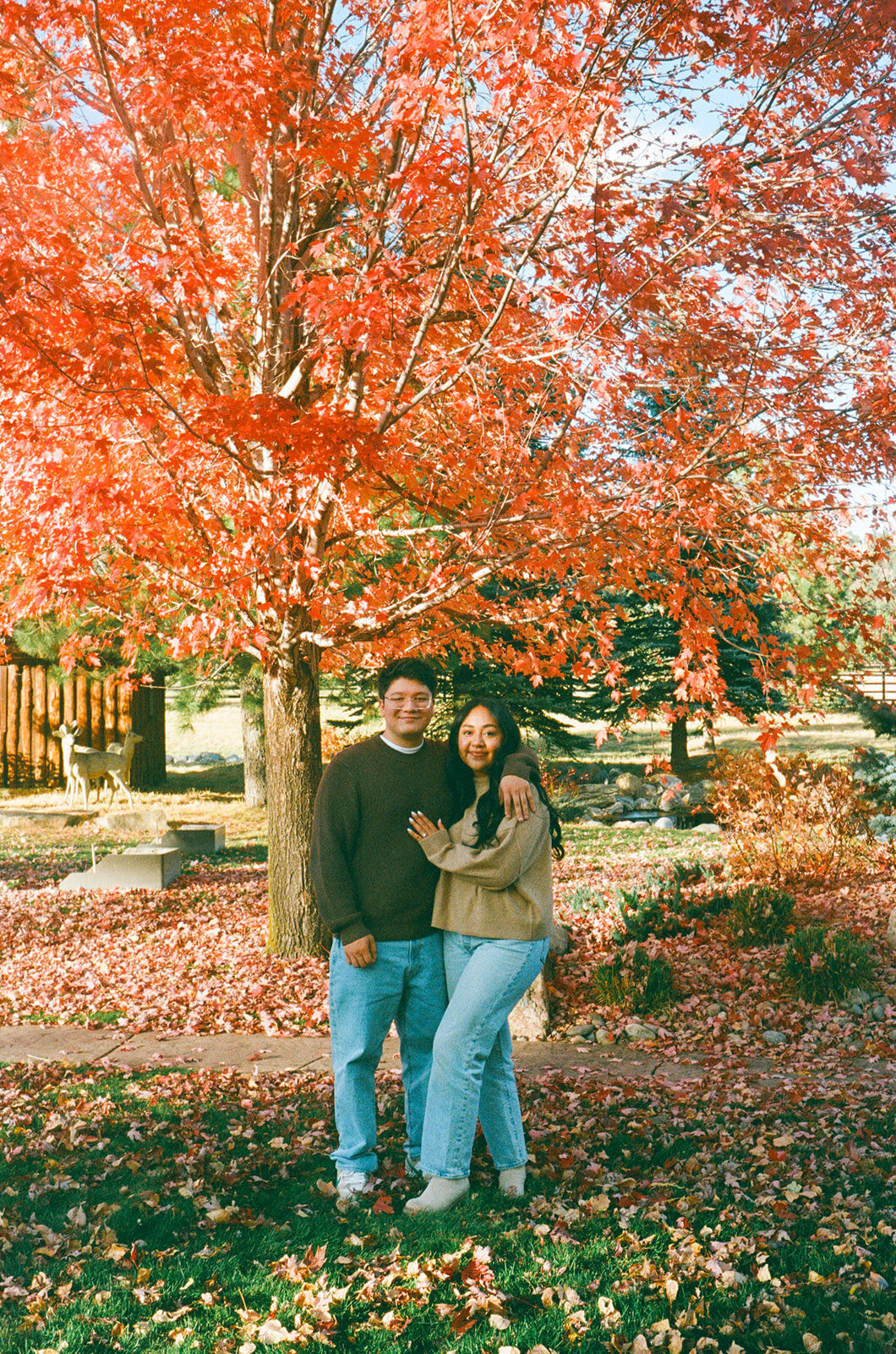 Couple laughing during engagement session in Denver’s foothills