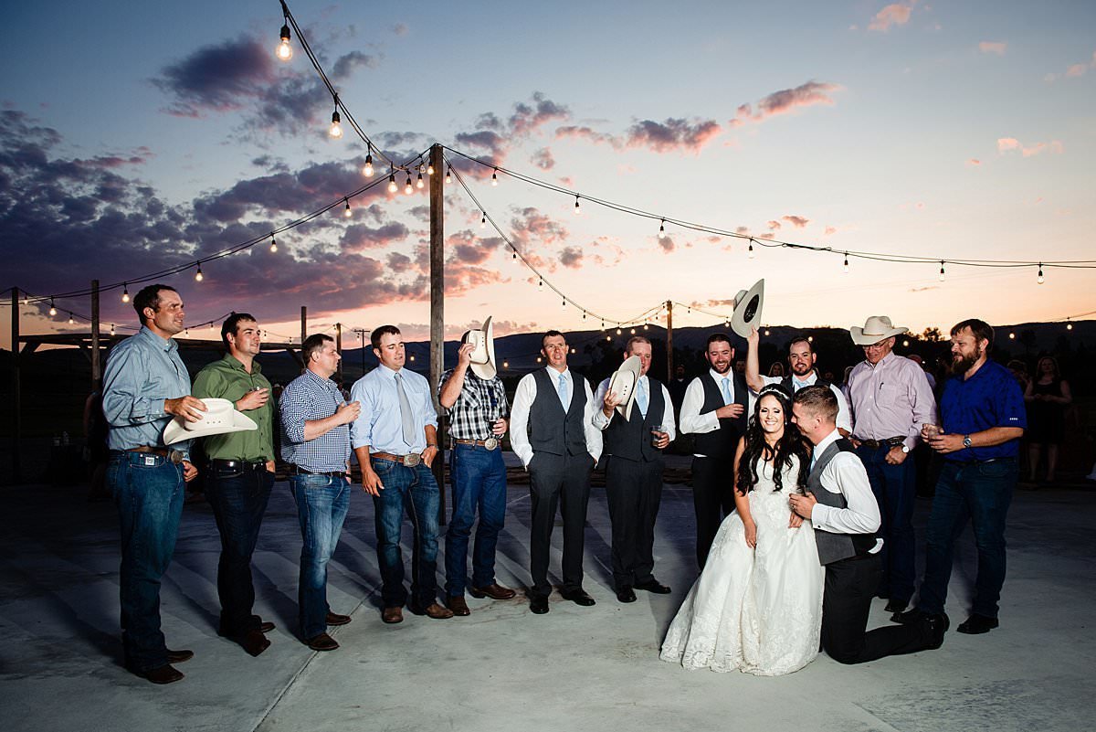 Alpha Gamma Rho serenading newlywed couple during  sunset in Big Sky country