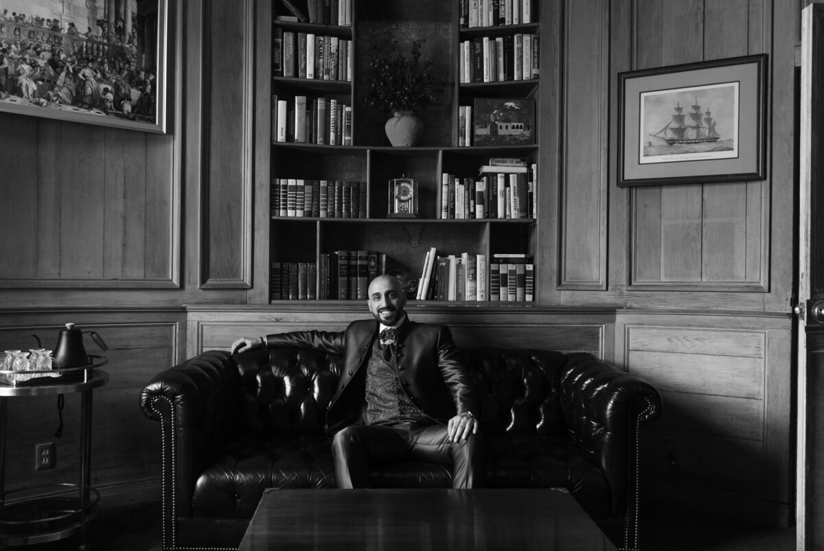 Groom sitting on a couch