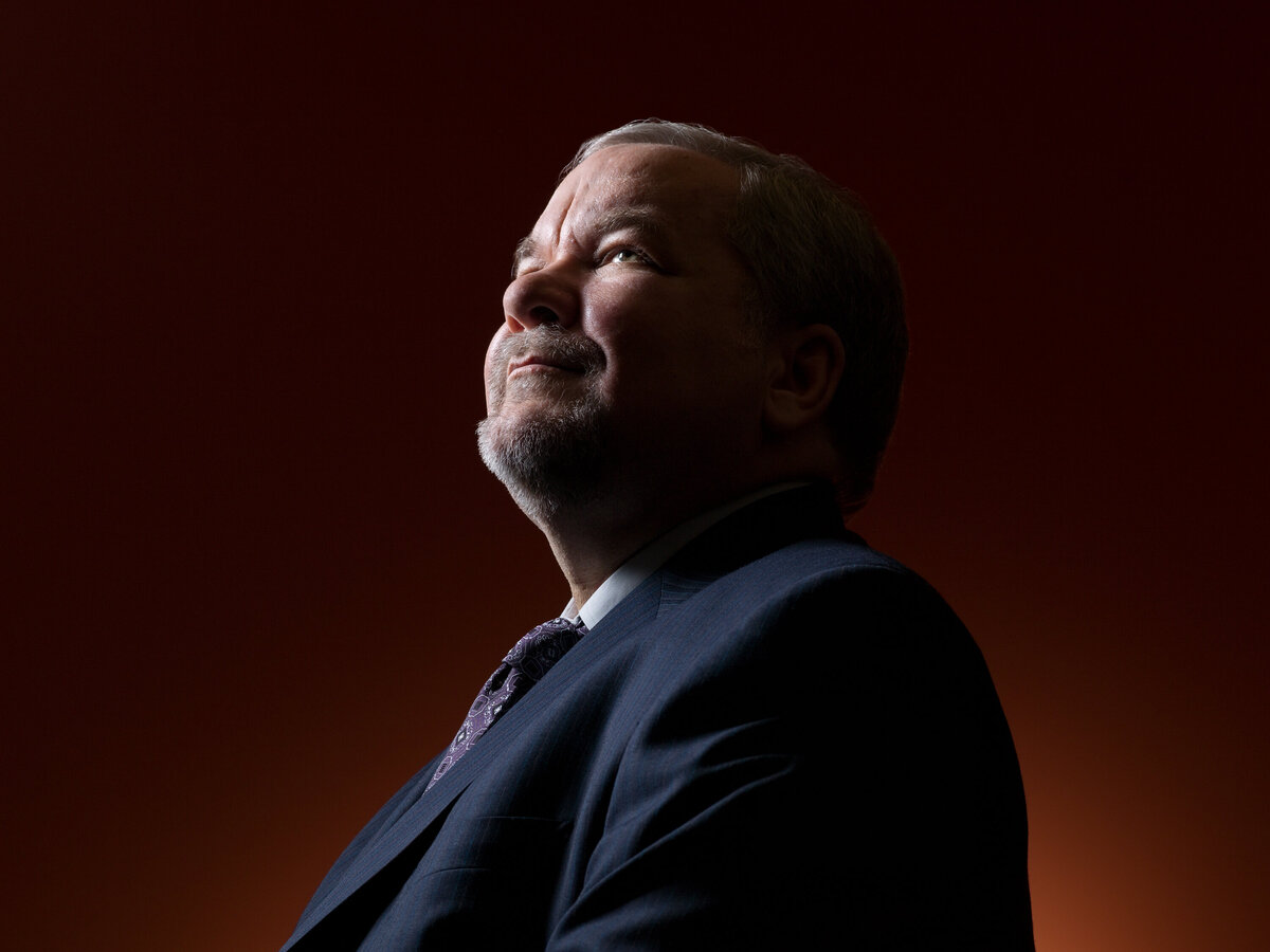 A man in a suit looking up