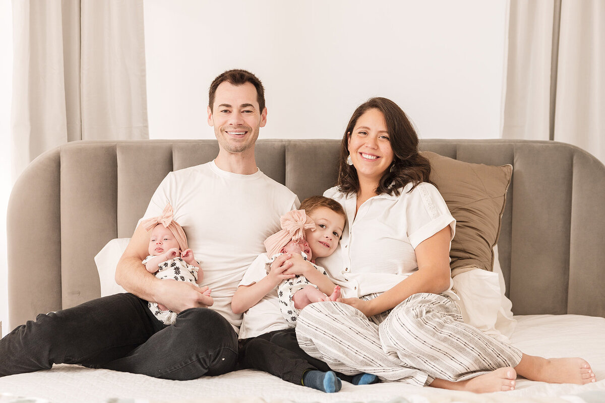 Father snuggling baby girl during relaxed in-home photo shoot in Orlando

