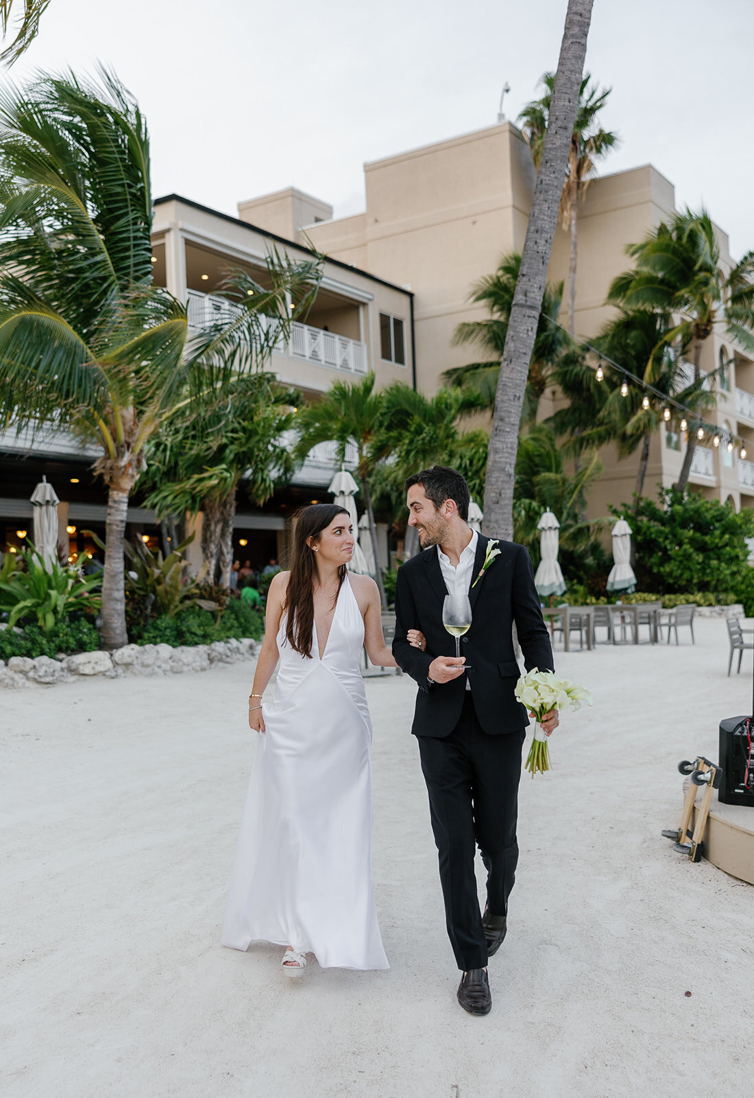 Minette and Evan’s love shines as they stroll through the sand together. Micro wedding photography by Claudia Amalia.