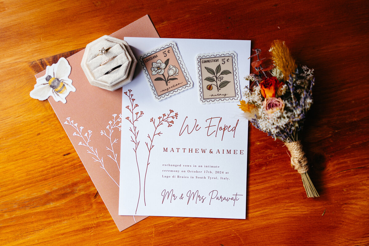 Flatlay with stationery, ribbons, and sentimental Dolomites elopement details