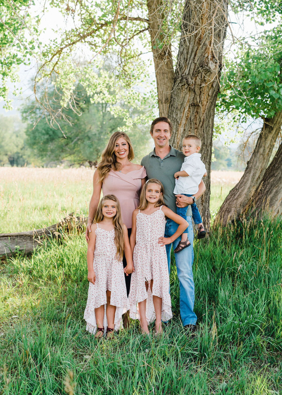 A family of 5 take a formal picture during their session with Northern Virginia Family Photographer
