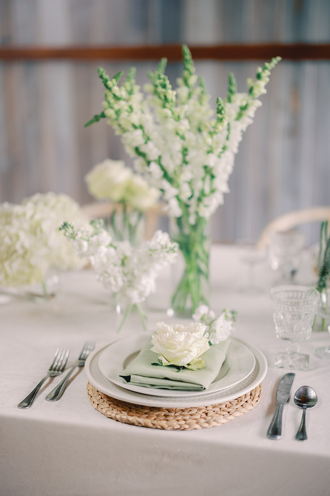 Table setting with white and green decor details