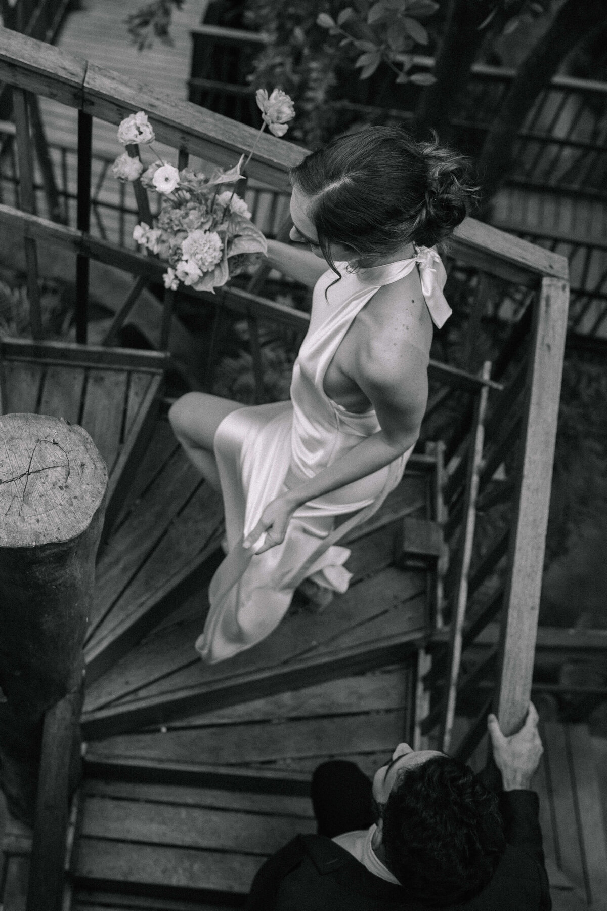 bride-and-groom-walking-up-stairs-nika-helgeson-photography