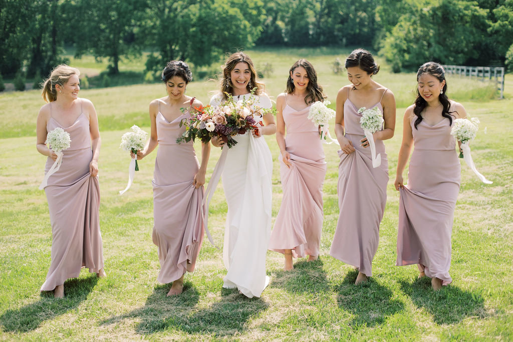 Bridesmaids in lavender holding simple bouquets by Gradient and Hue