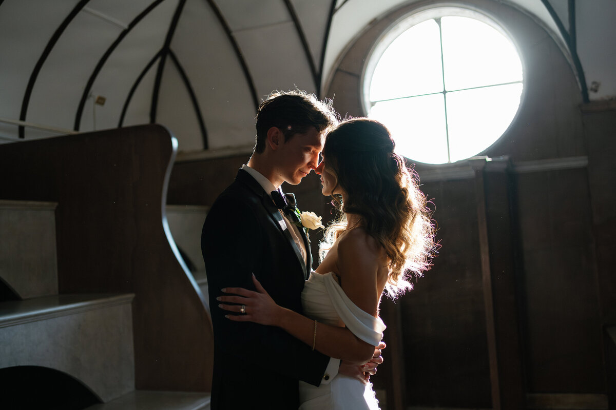 bride and groom holding each other close by east coast photographer