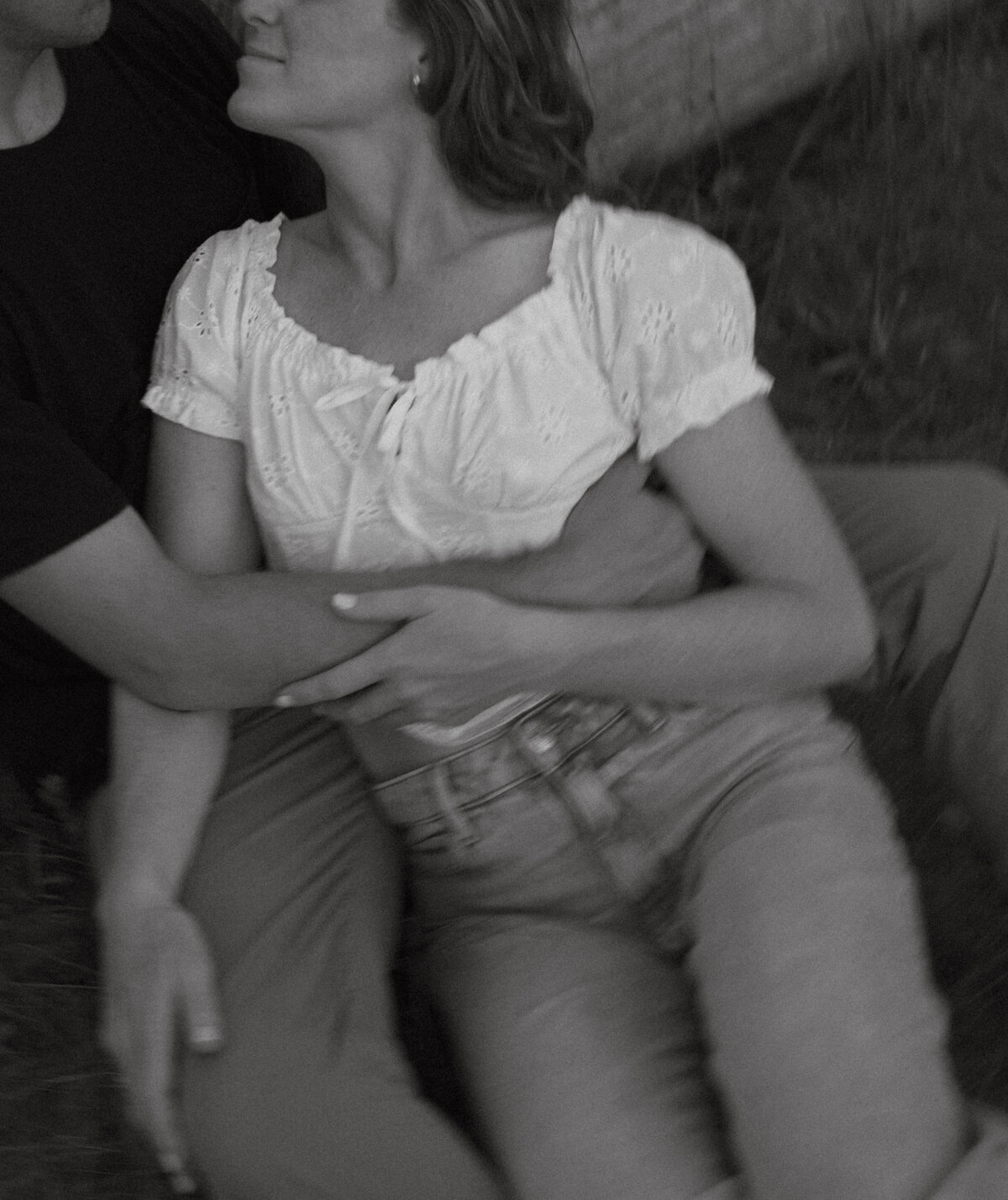 Couple posing for portraits in a forest.