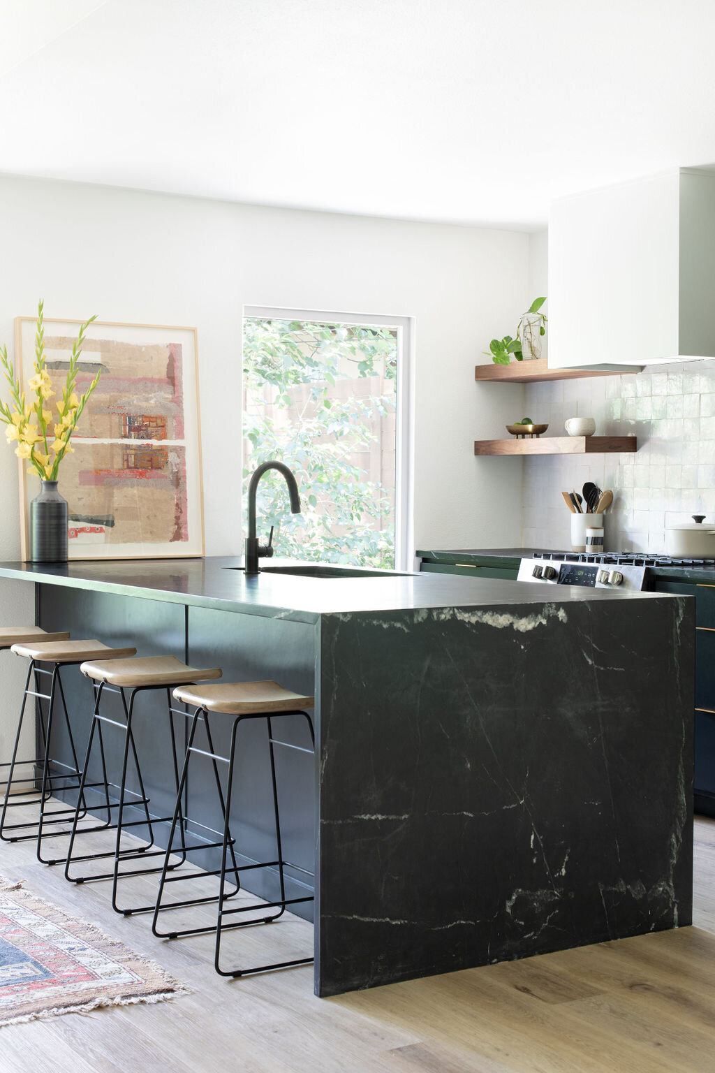 hello-home-austin-black-scandinavian-kitchen-waterfall-peninsula-zelliege-backsplash-black-cabinets-7
