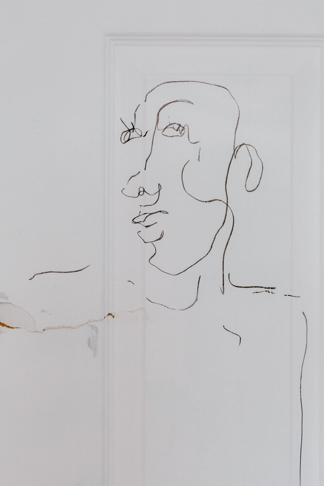 abstract sketch on a white door