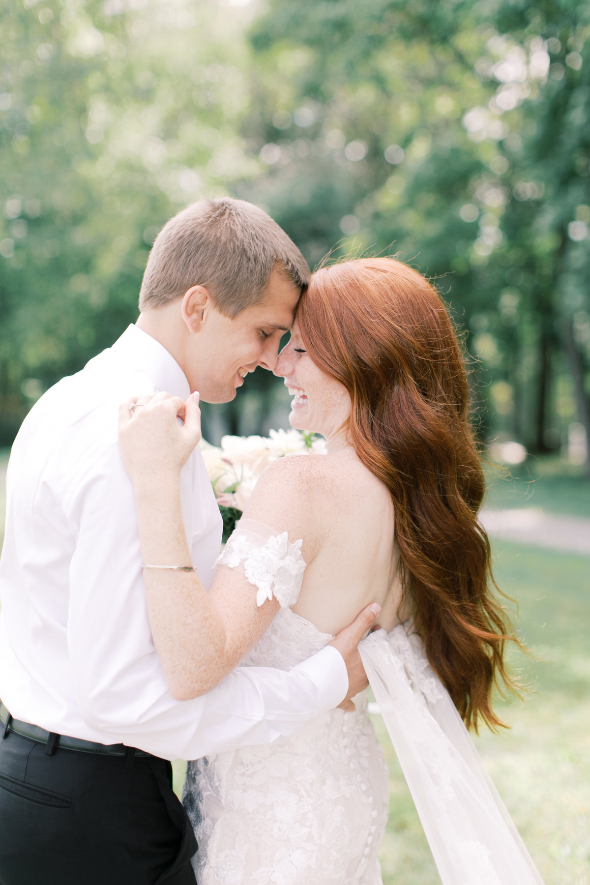 auburn haired bride with groom in outdoor lancaster pa wedding