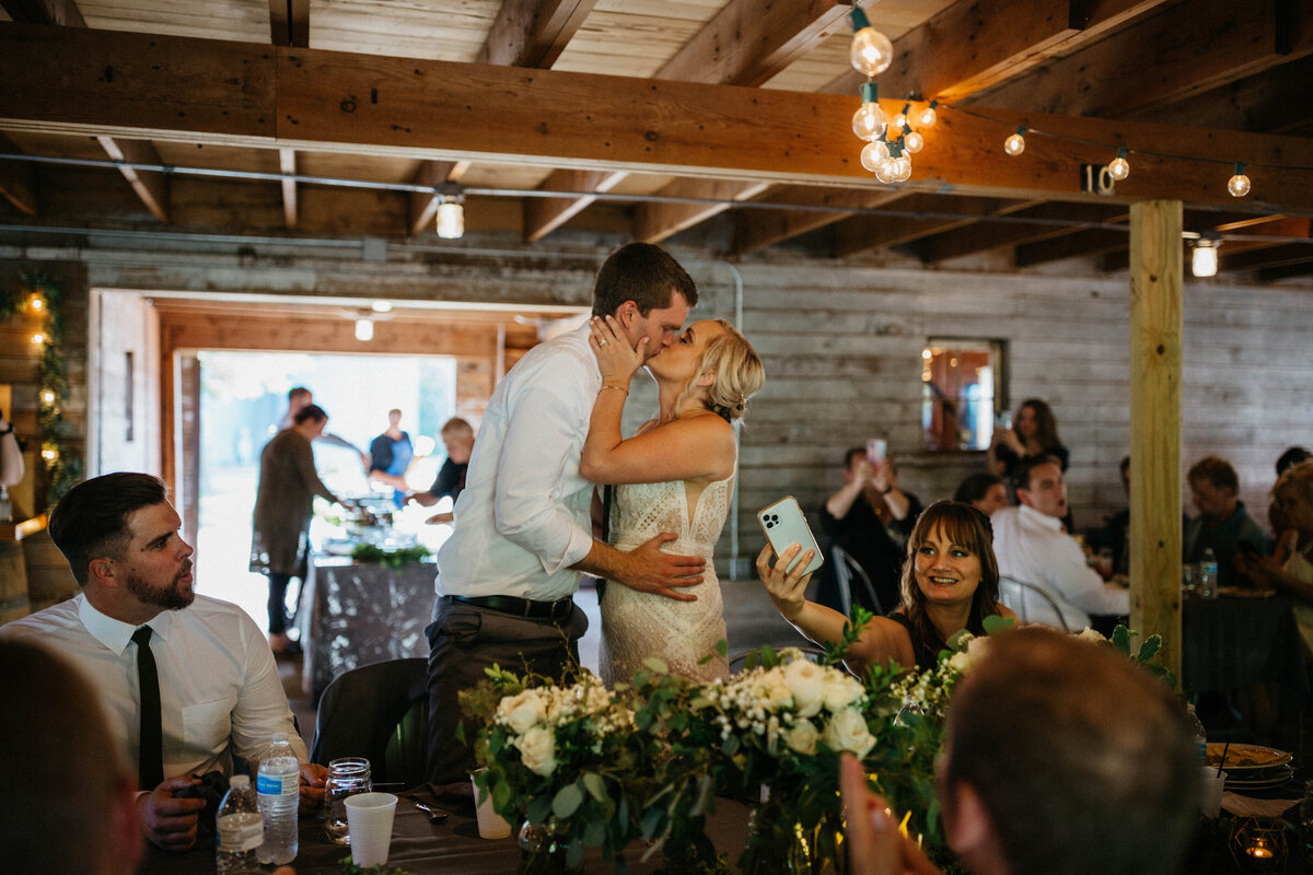 bride-and-groom-kissing-at-reception
