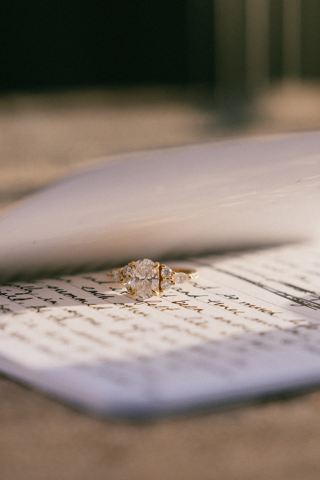 Ring sits between the pages of a vow book hand written for an elopement the following day. 