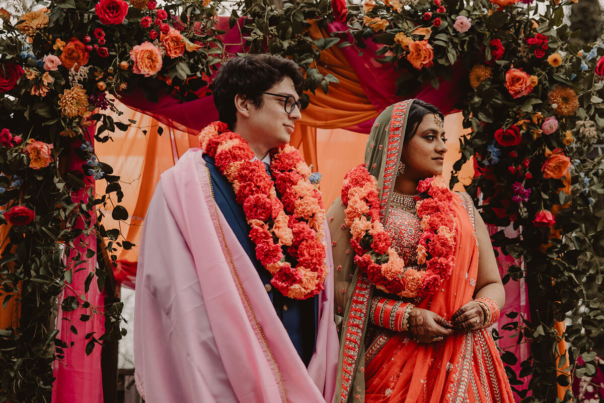  A newlywed couple standing together during a wedding ceremony 