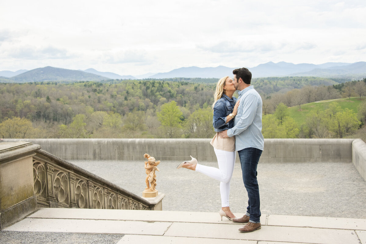 Couple kissing Biltmore Estate engagement photography mountain view