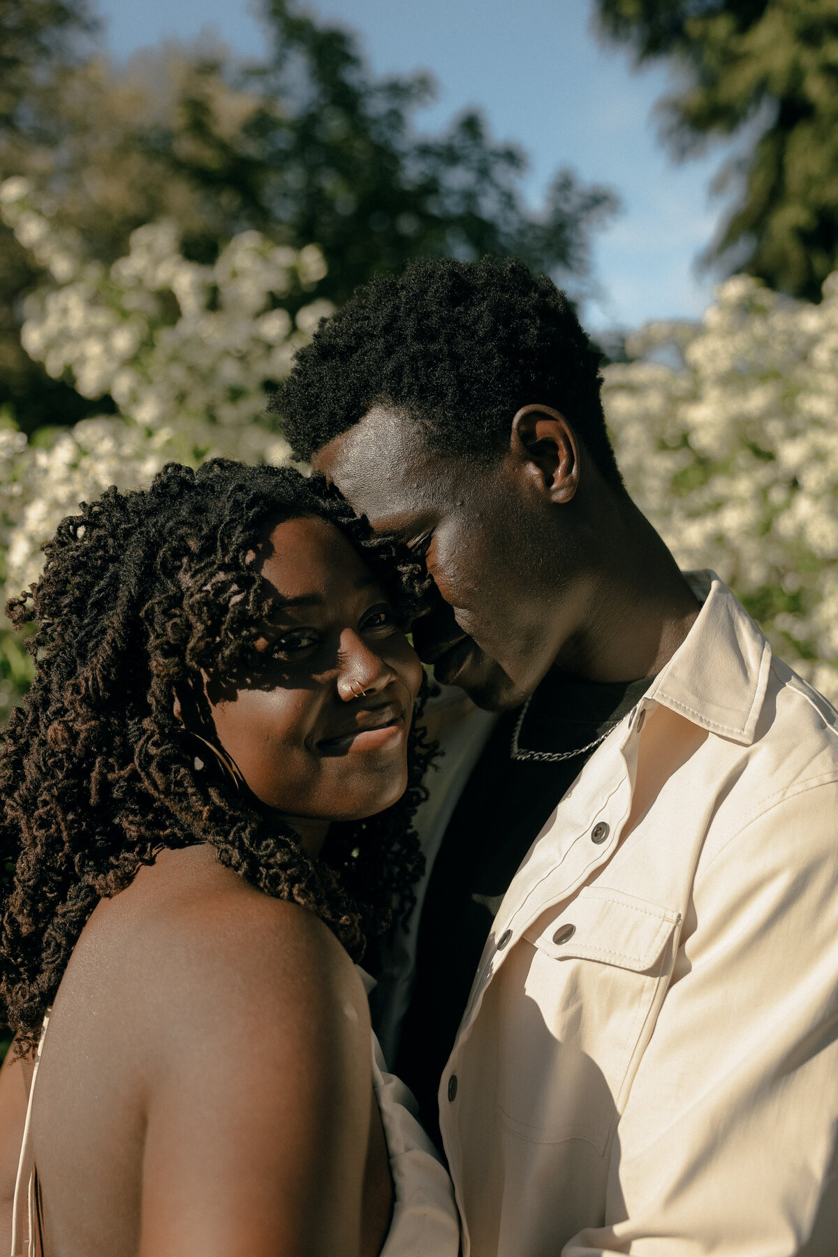 Golden Hour Couples Portrait Surrounded by Blooming Trees in Oregon