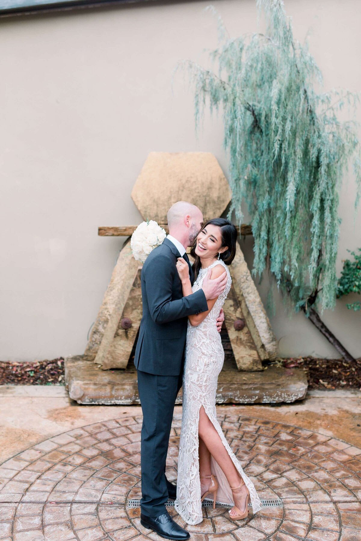 bride and groom hugging