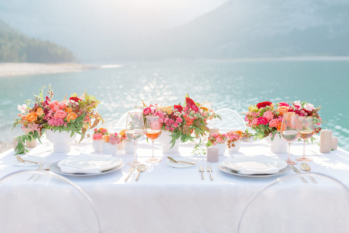 Gorgeous colourful lakeside wedding decor by Moments by Madeleine, a romantic and elegant wedding planner based in Calgary, Alberta. Featured on the Brontë Bride Vendor Guide.
