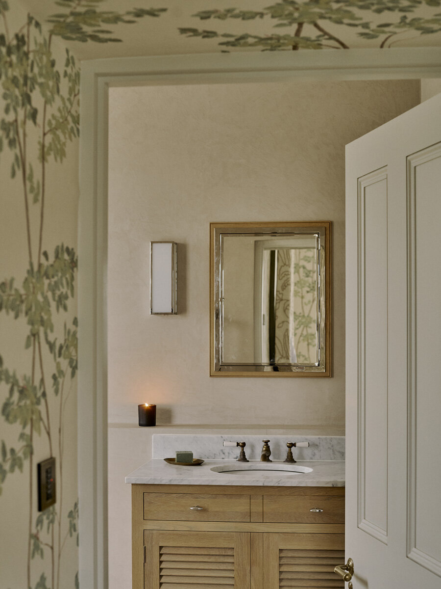 candle lit bathroom through door