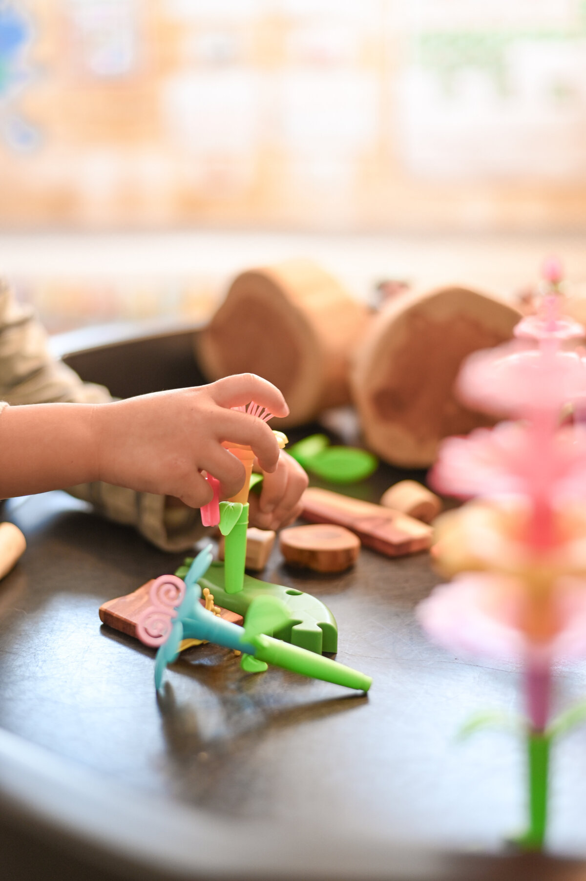 Student playing with imaginative and engaging toys at House of Parker Preschool in Gorham Maine where we believe that play isn’t just something children do—it’s how they learn. 