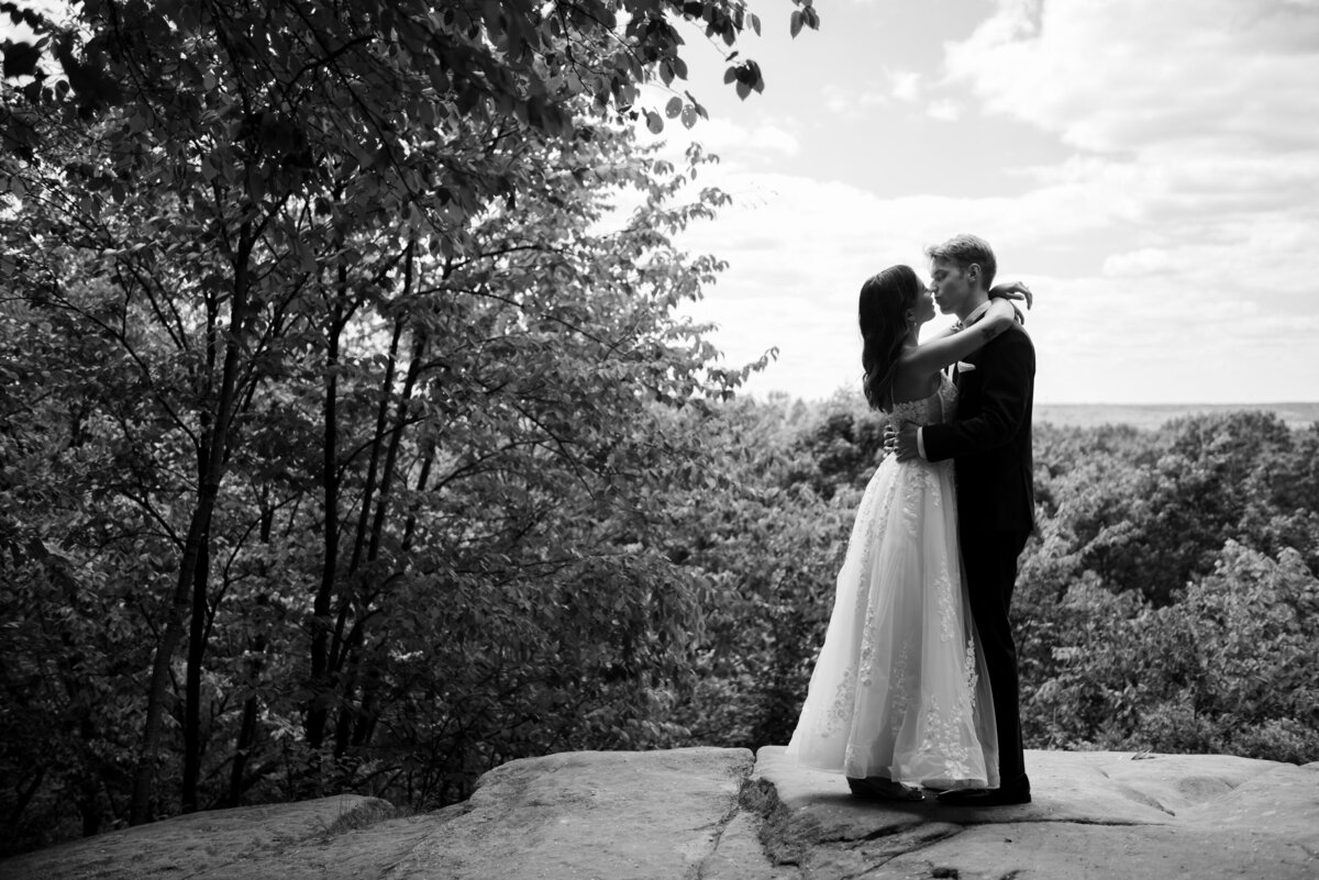 Bride and her groom hug one another on the overlook at Cuyahoga Valley National Park, in Peninsula, Ohio. Photo taken by Aaron Aldhizer