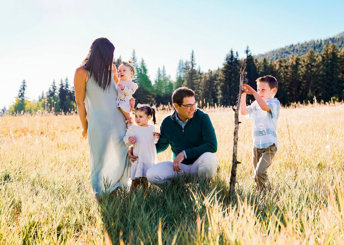 family photography denver co - family of 5 smiling in field