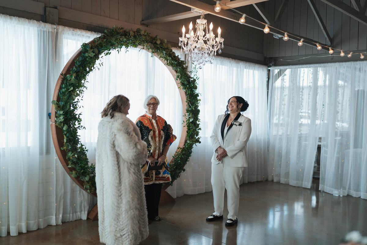 Brides stand at the altar of their LGTBQ Tennessee elopement 