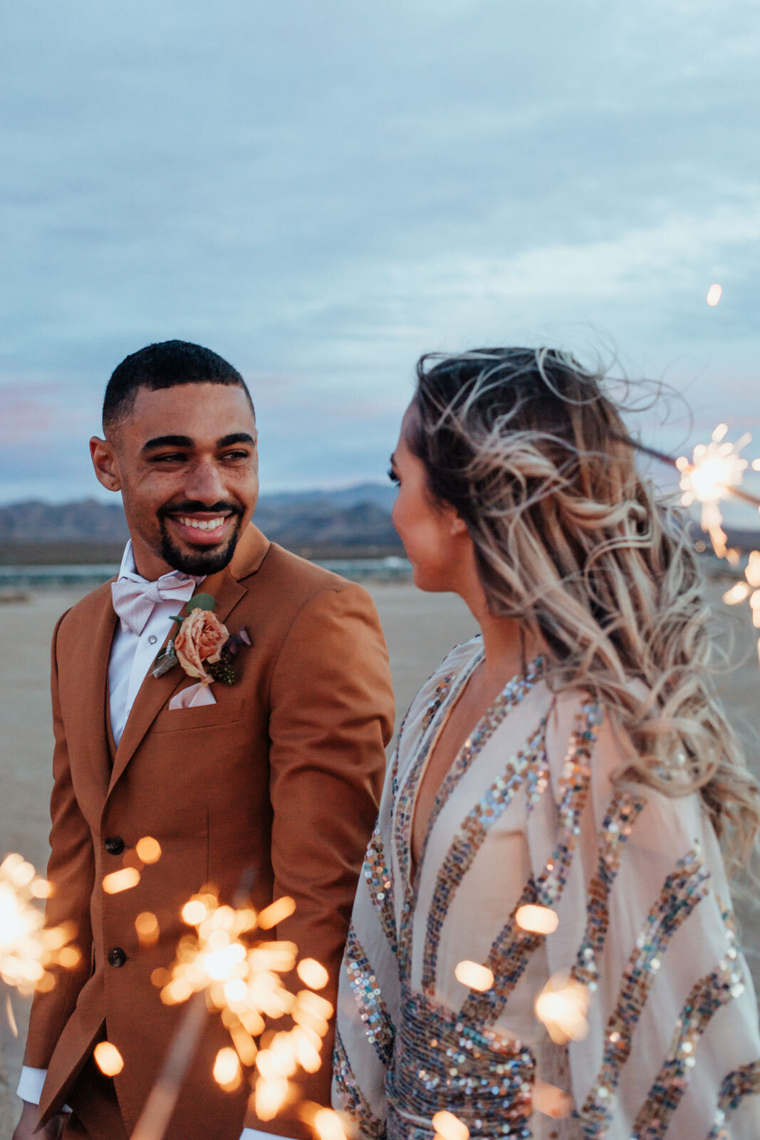 elopement couple with sparklers at the dry lake beds in Las Vegas