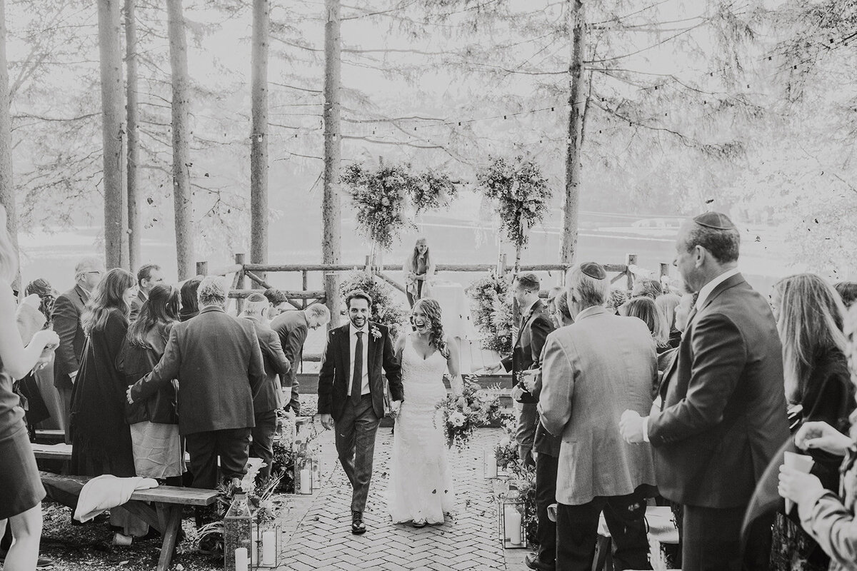 walking-ceremony-aisle-cedar-lakes-rustic-wedding