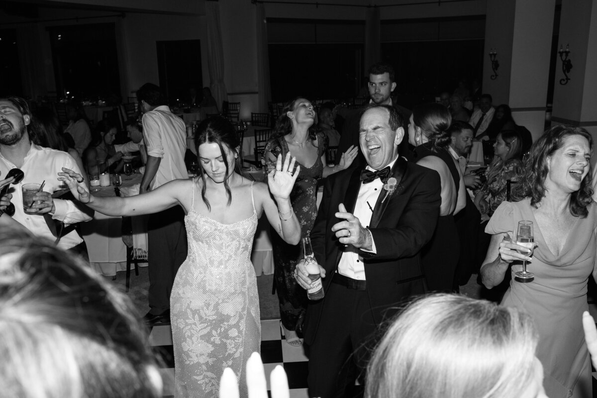 Dynamic flash dance floor photos capturing the energy and excitement of the celebration at a La Jolla California wedding.