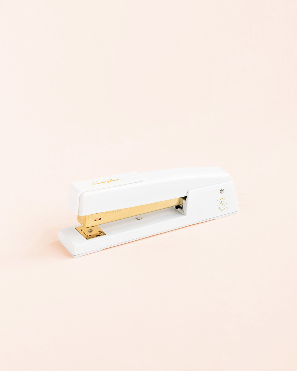 Stapler on pink-web