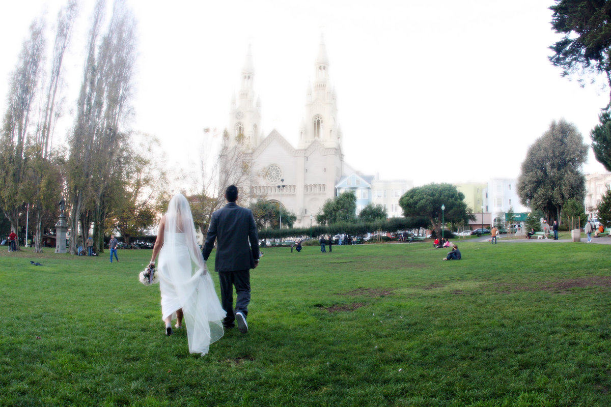 bride and groom walking in park in San Francisco