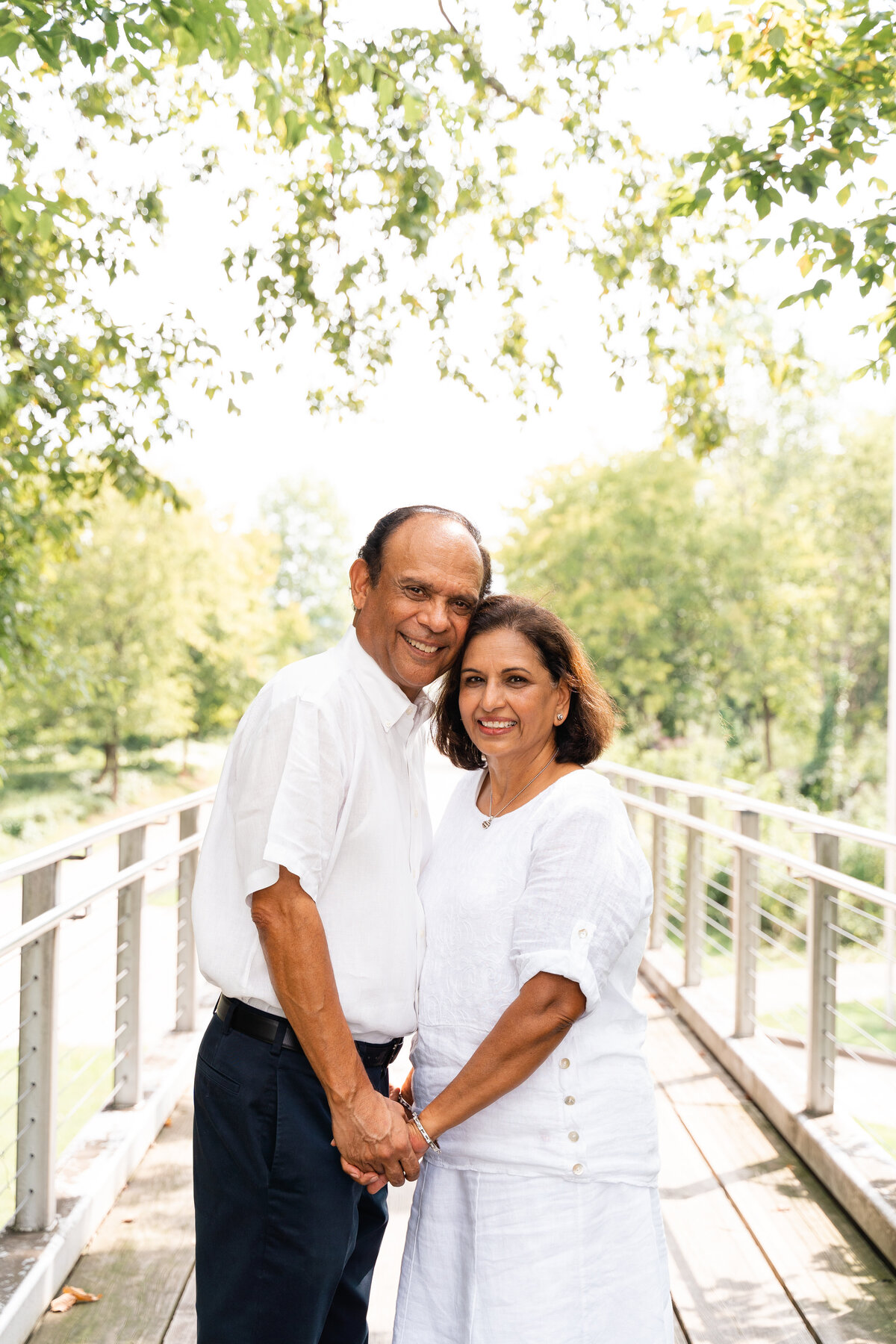 Couple hugs on bridge in Renaissance park Chattanooga